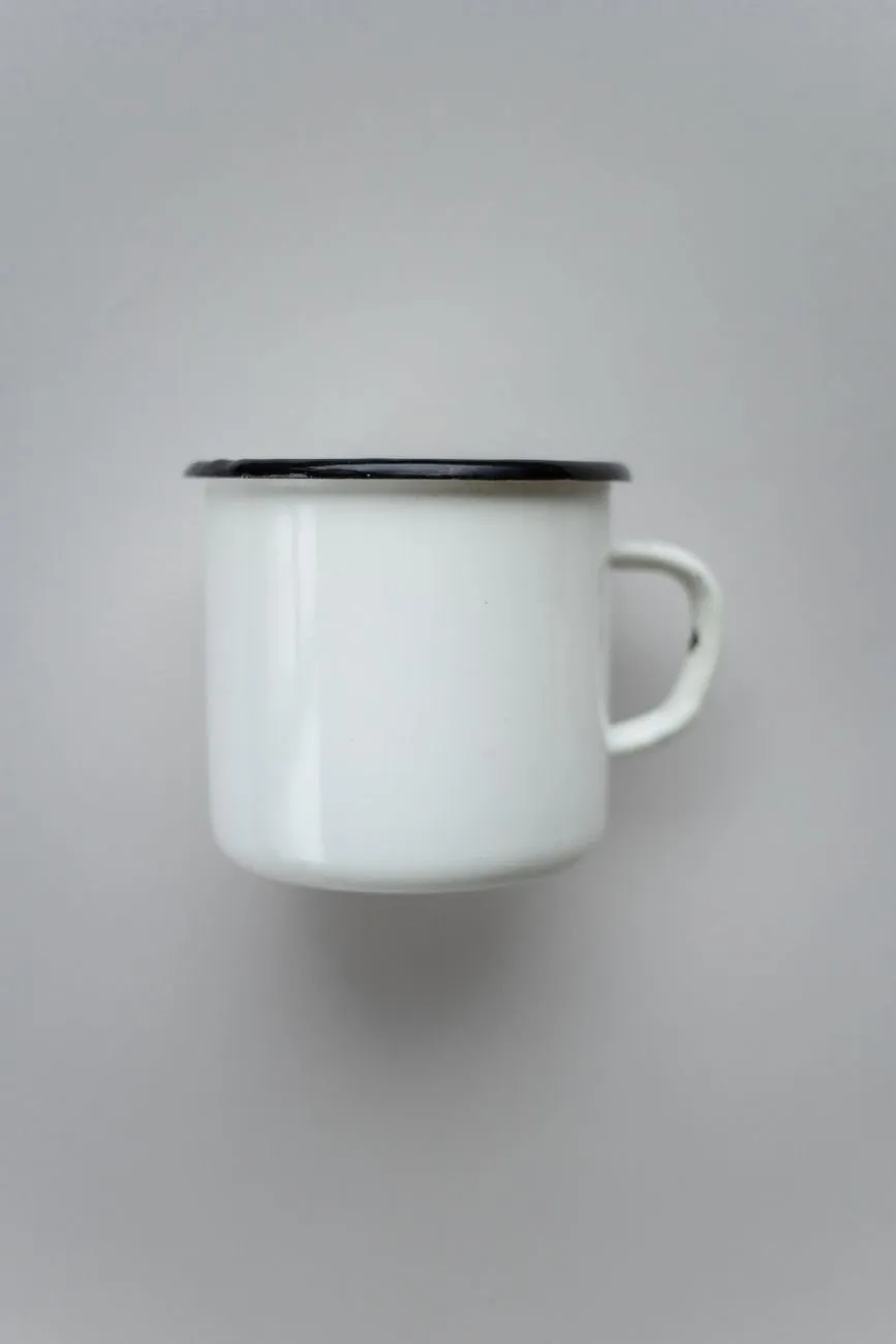 A Foundry Mug in Frit White on a plain grey background